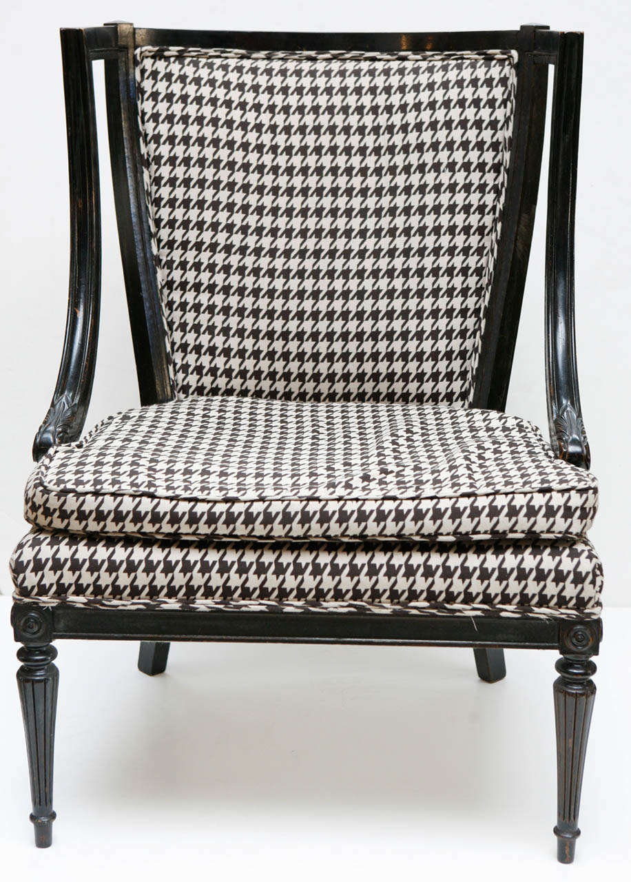 Pair of 1940's houndstooth armchairs with black wood frame and original upholstery.