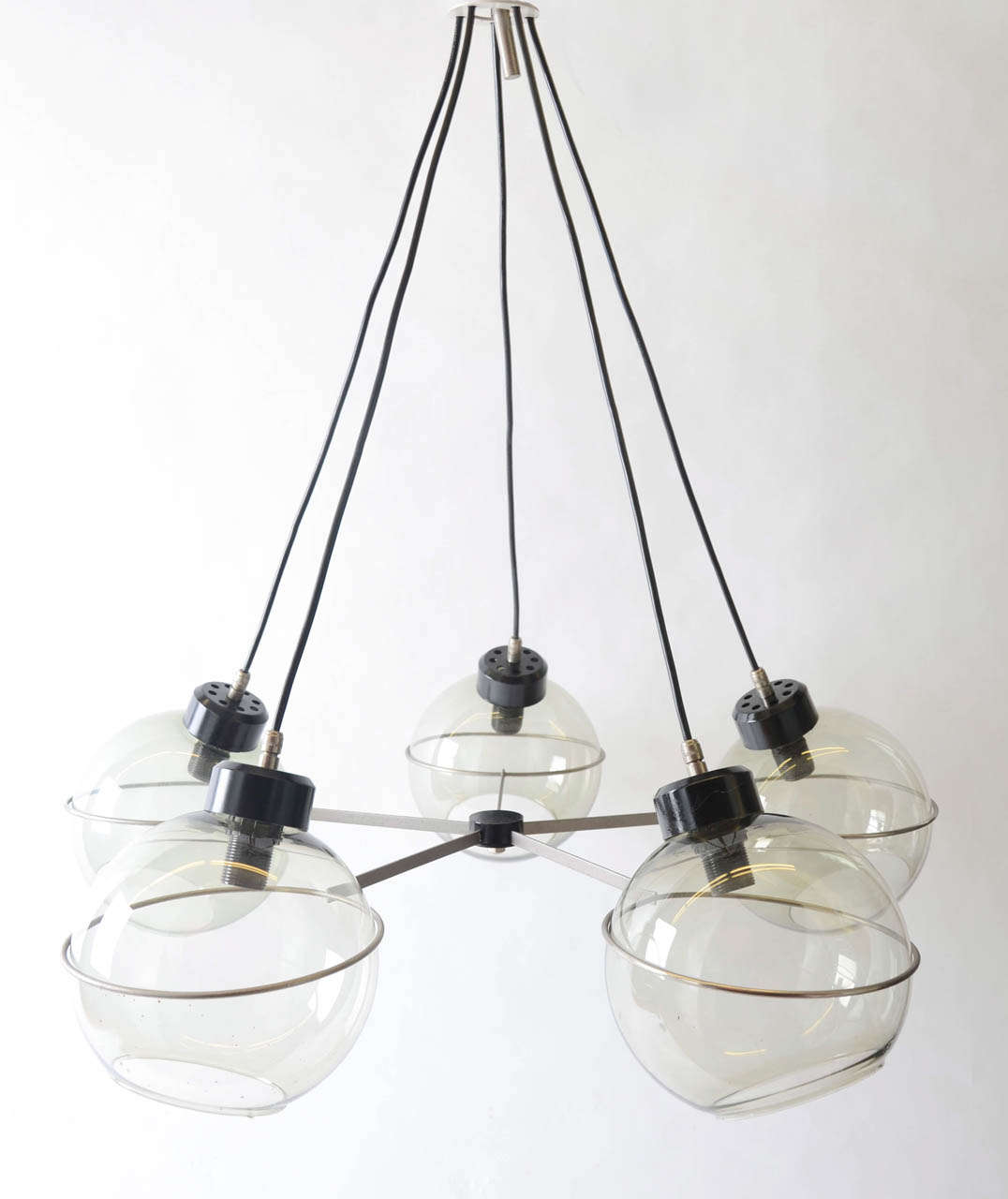 A fine, rare example from the Italian lighting designer Vico Magistretti.

Five globe suspension from the 1960s.
In excellent condition with all the original (tinted) glass globes.