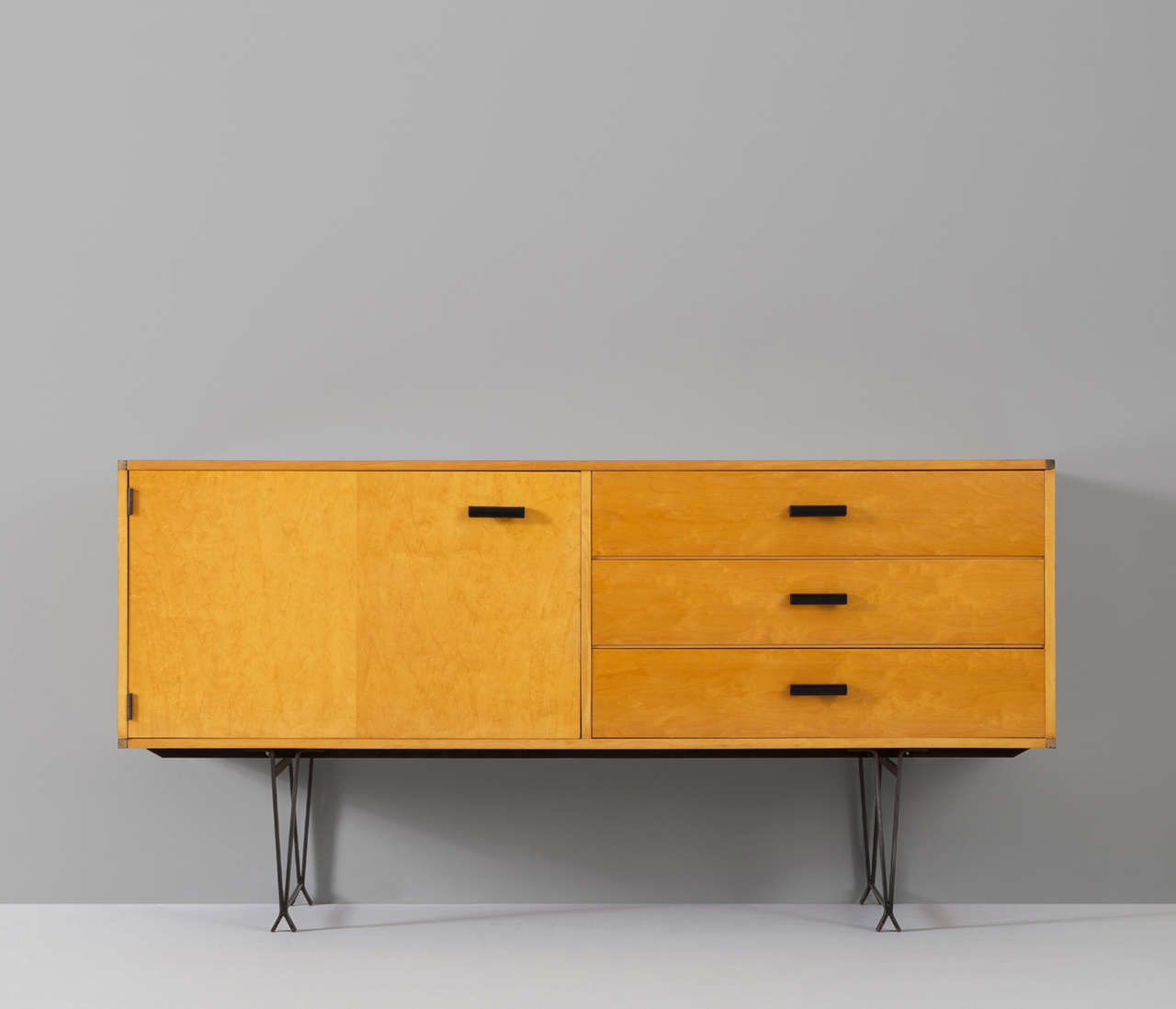 Very well designed and quite unique piece by Dutch manufactory.

Fristho, also named as the best Dutch cabinetmaker of the mid-century, produced this rare console with highly elegant details.

The black coated solid legs are in wonderful contrast