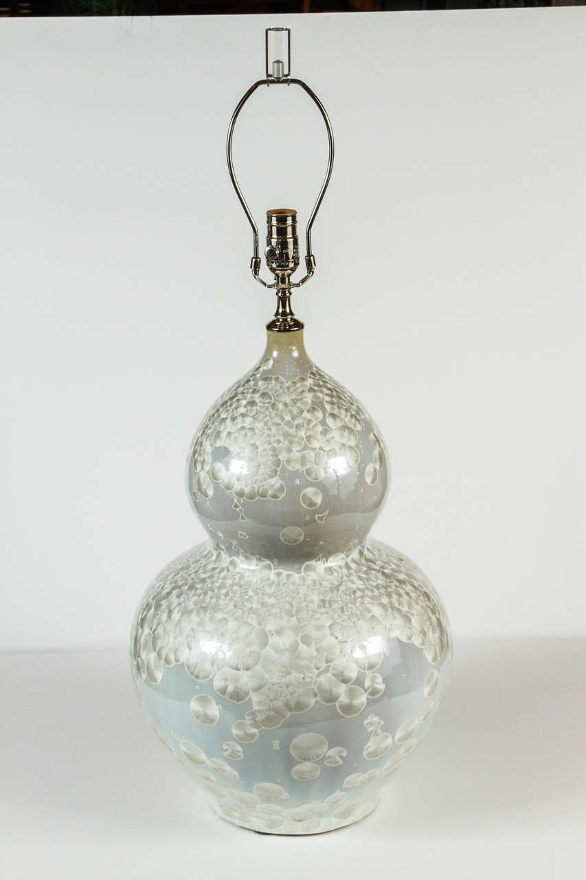 Ceramic table lamp with pearl motif and Lucite finial.