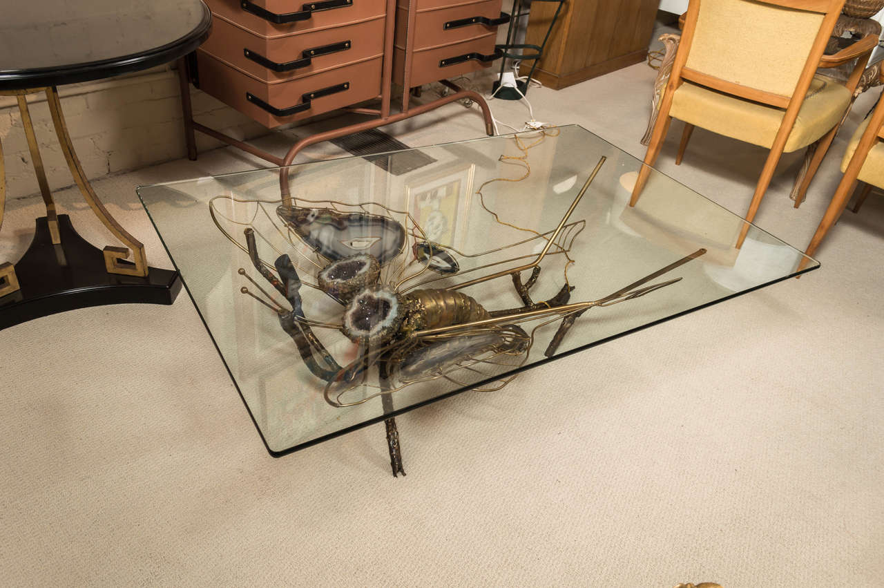 An exceptional and unique, illuminated, welded brass and glass top, cocktail table, with butterfly motif and wings. Attributed to Jacques Duval-Brasseur,  France, circa 1970 (Rewired).
Provenance: Private collection, French Riviera.