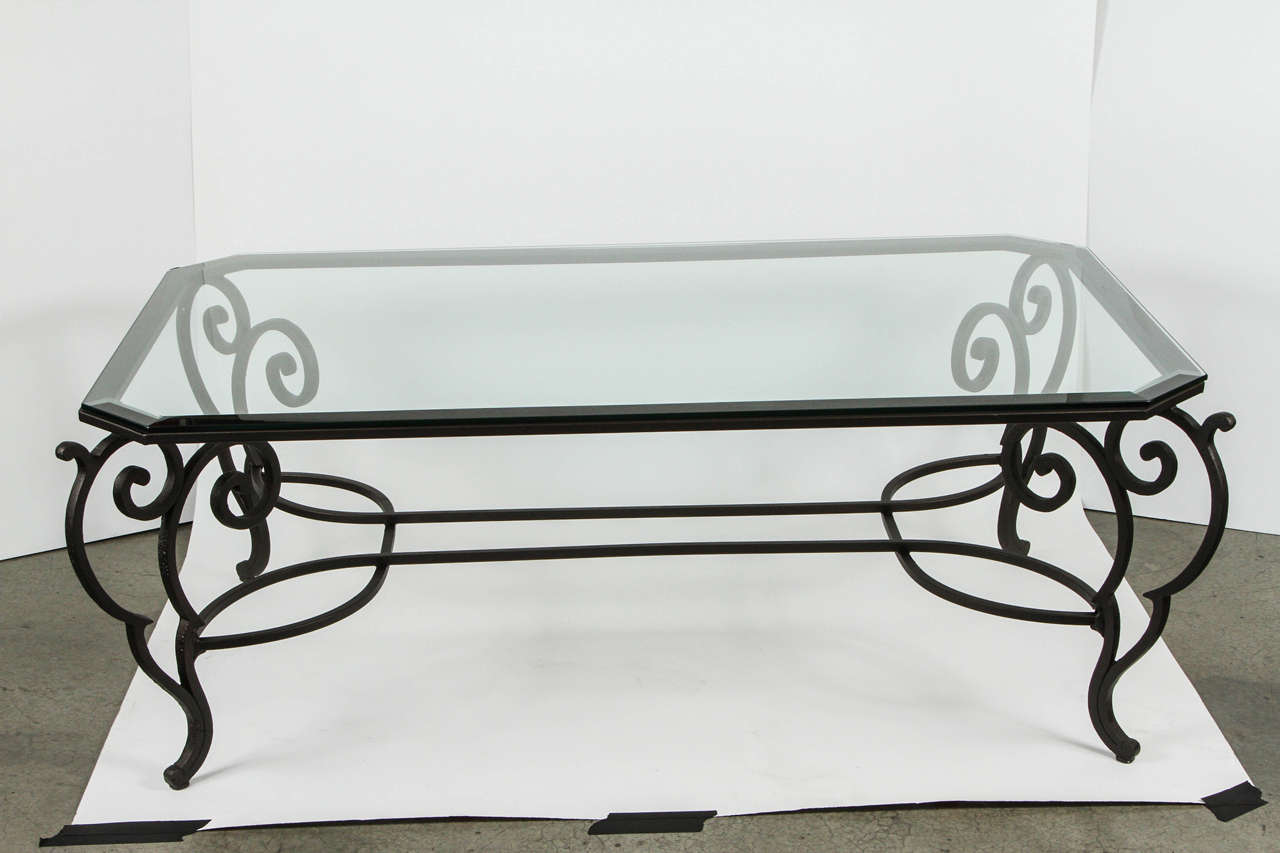 Vintage iron coffee table with new powder coated finish and new beveled glass top.