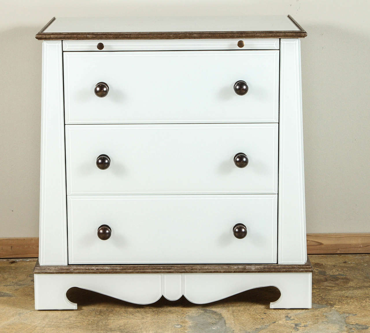 Modern Neoclassical style pair of Paul Marra European Style Chests in opaline-style glass (reverse painted glass).  Painted white back side, interior and shelf. Brass handles, French clad wood molding in brass finish. Three drawers and one pull-out.