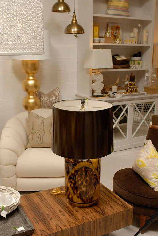 * Unique tortoise style table lamp<br />
* Original brass base<br />
* New chocolate paper shade<br />
* Original finial<br />
* Three way switch<br />
* Newly wired