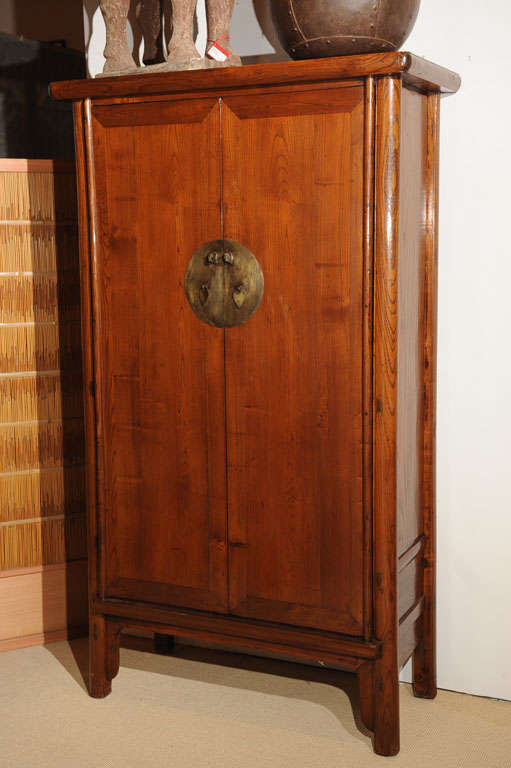 Beautiful elm wood armoire with 2 doors and 2 drawers. Ample storage space for clothing or electronic equipment.