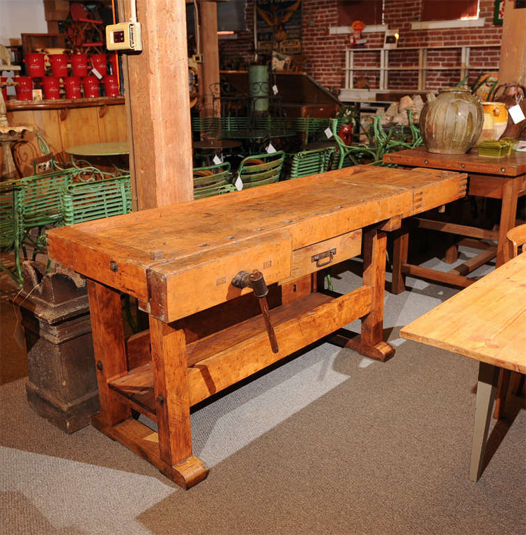 Industrial adjustable wood with metal hardware work bench/table  with 1 drawer.
Late 19th C.
France