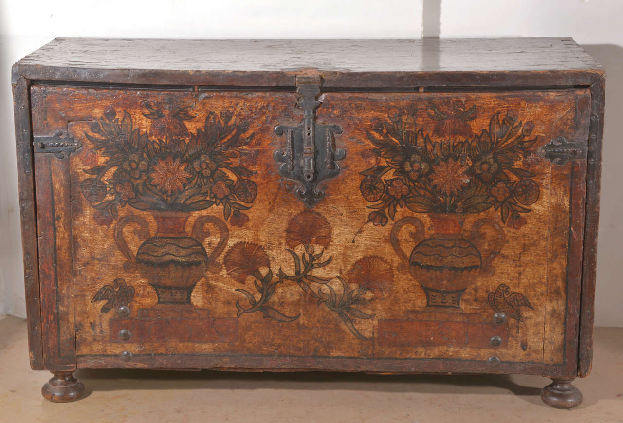 18th c. bargueno traveling desk, used for storing documents, jewels, or sewing box.
It's walnut with original painted floral motif in urns on door. Beautiful original hardware .  Key missing