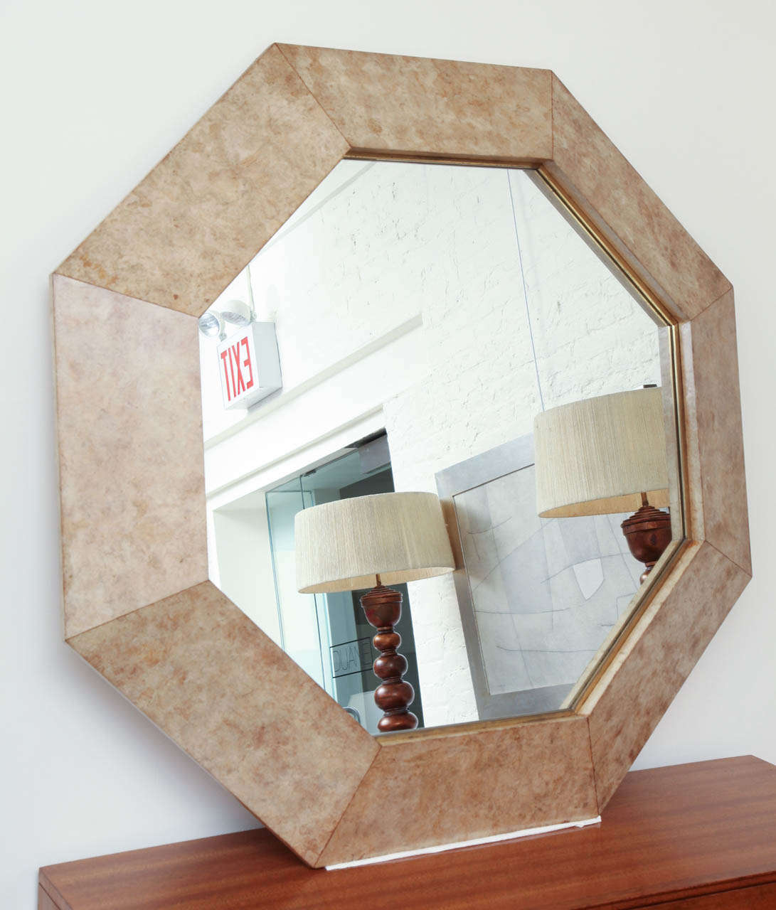 Large octagonal lacquered parchment mirror with wide border in the manner of Karl Springer c 1970