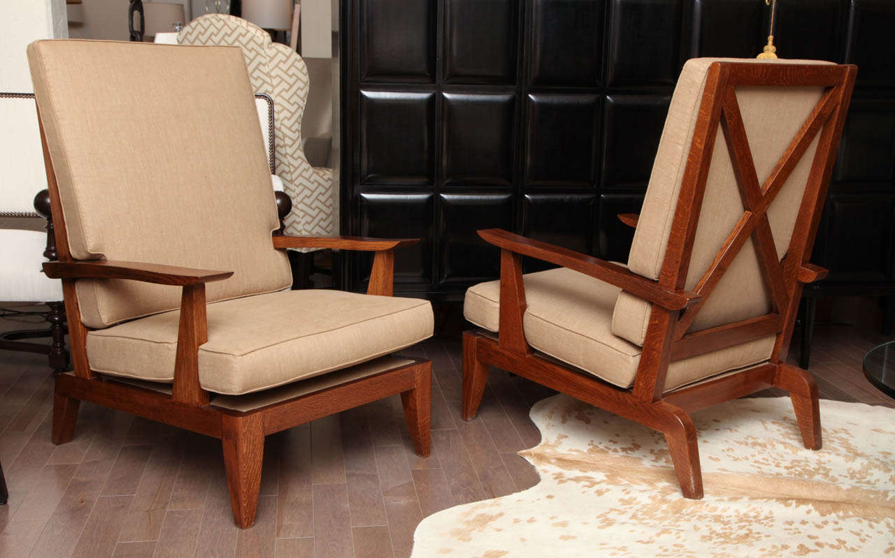 Pair of  large oak armchairs with criss-cross backs and new upholstered seat and back cushions, French c. 1940