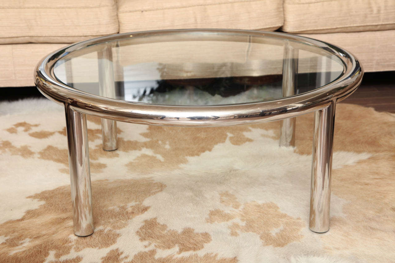 Round polished aluminum and glass cocktail table by John Masceroni, c. 1970