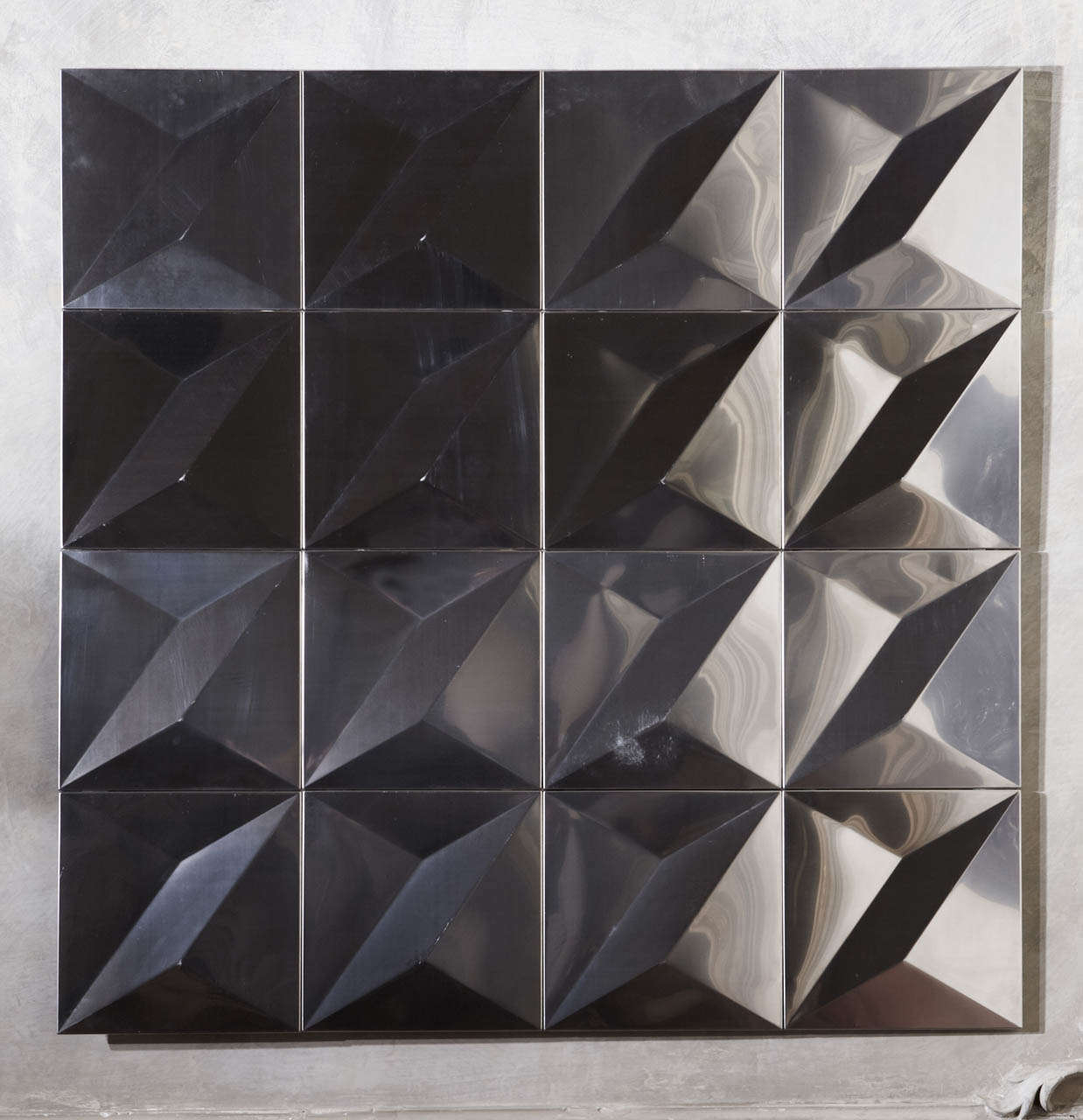 Wall decorative panel composed by 16 stainless steel panels