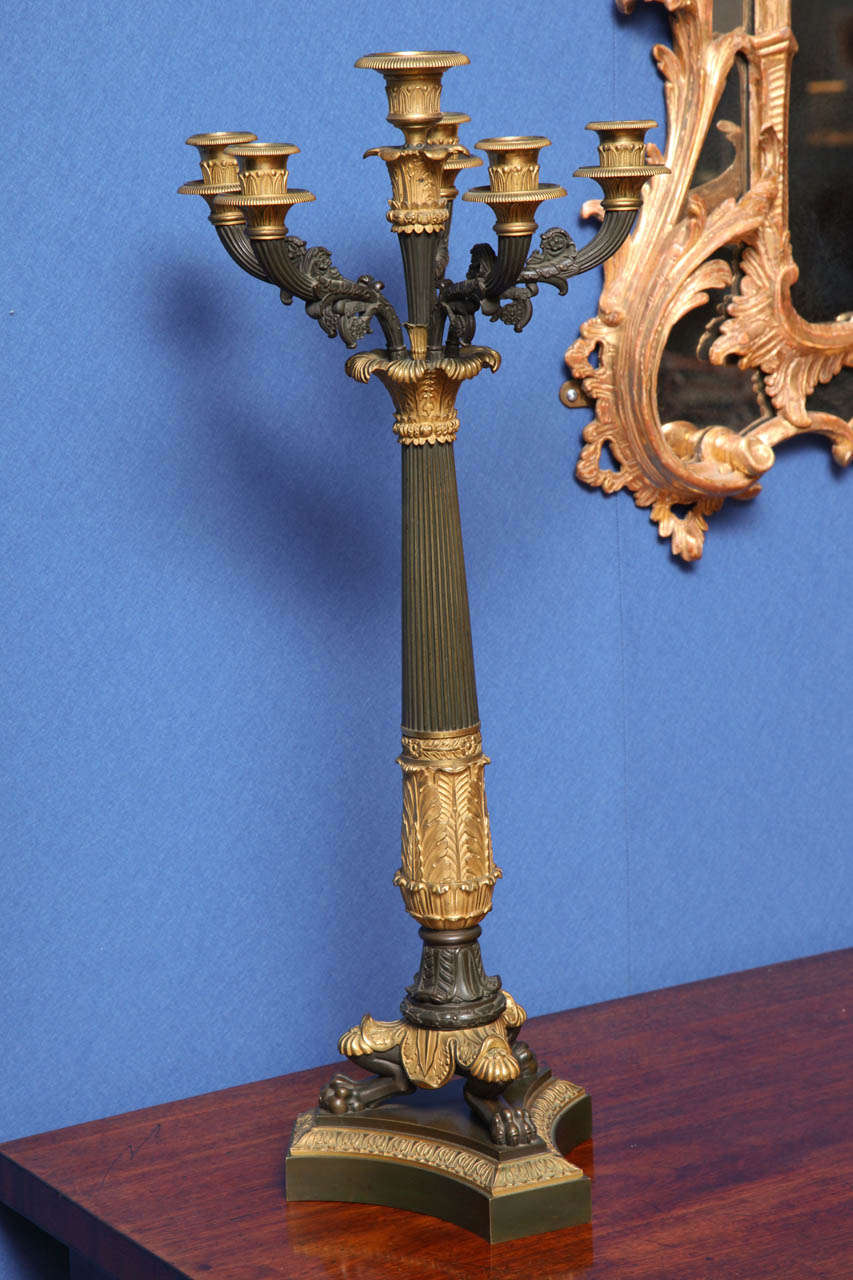 Fine pair of Charles X cast and chased six-light fluted columnar candelabra on triangular bases, French, circa 1824-1830.

Measures: Height 26
