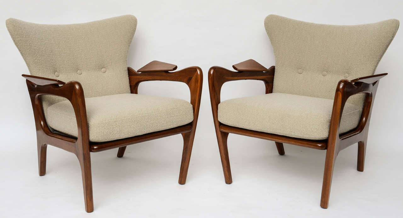 Absolutely stunning pair of low wing back lounge chairs by Adrian Pearsall for Craft Associates. Impeccably restored walnut frames, with new foam cushions and padding, immaculately upholstered in Knoll's 