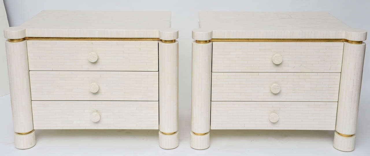 Immaculate bone tiled night stands have been completely restored, inside and out. Lovely, nuanced shades of off-white and cream, with subtle gold-leaf banding.