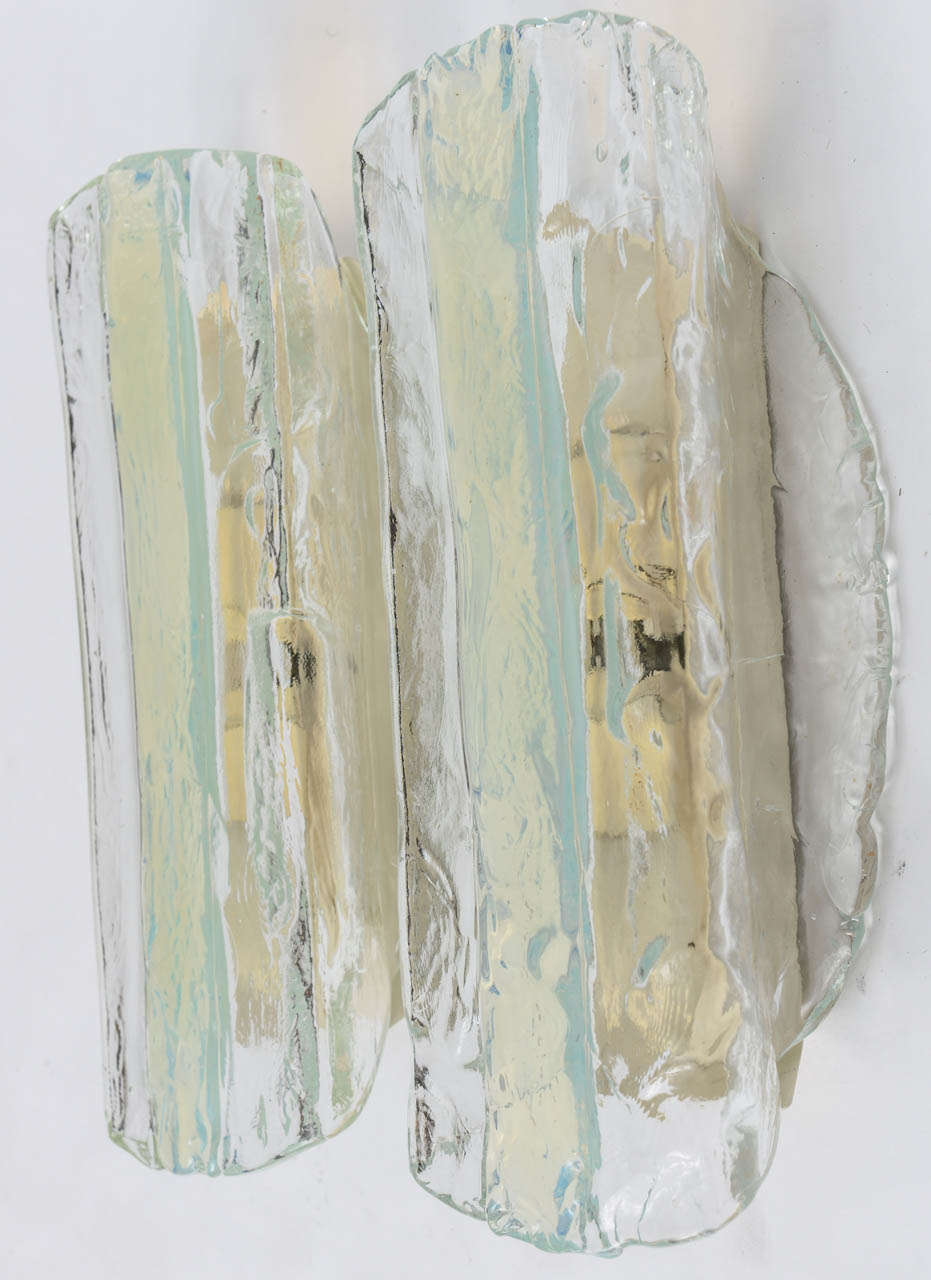 Pair of sconces by Venetian glass-blowing firm A.V. Mazzega. Clear textured glass has a strip of fused, green-ish blue, opalescent glass applied down the center of each sconce… beautiful, watery, tones - perfect for a beachside abode. Each sconce