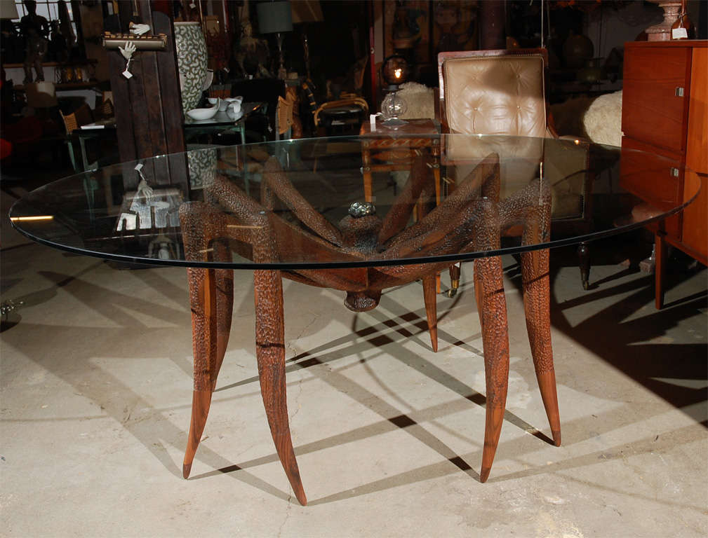Walnut base table with glass top.