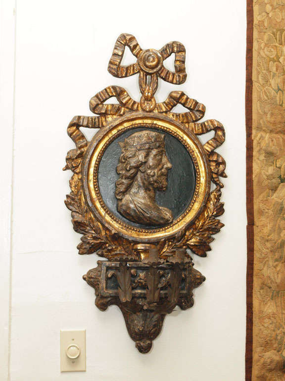 18th century Italian wall sconces with bas relief of king and queen. iron candle arms hand forged.