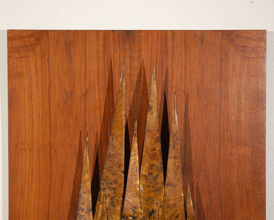 Gold leaf torch-cut metal tree scene mounted on walnut.
