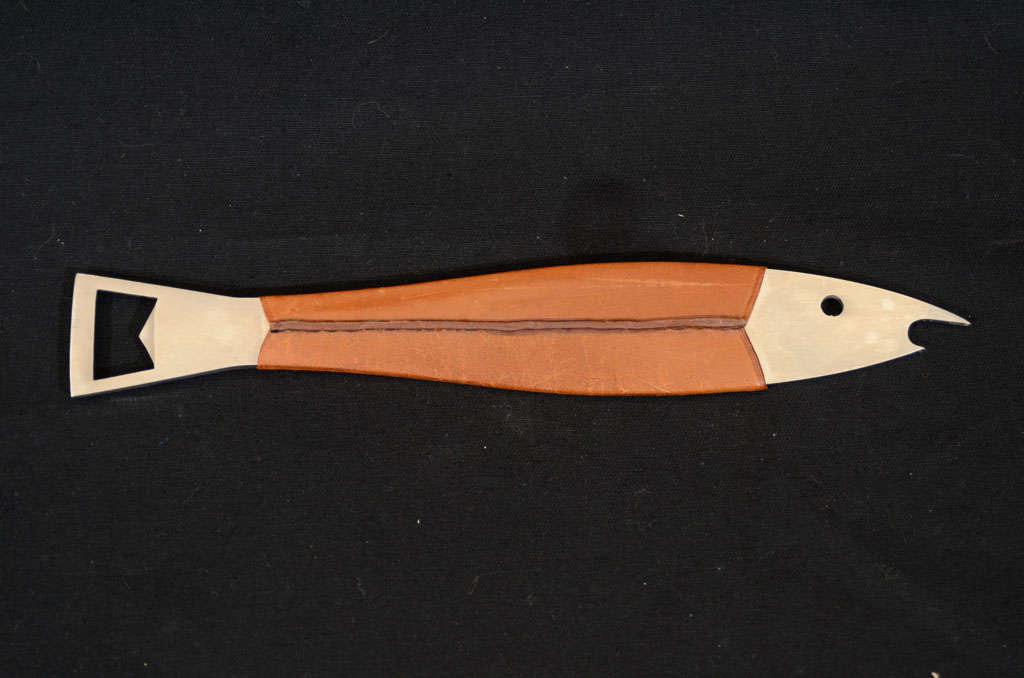 Leather wrapped stainless steel bottle opener in the form of a fish. Designed by Carl Aubock (1900-1957), one of the most renowned figures of the Austrian Modernism movement. Marked 