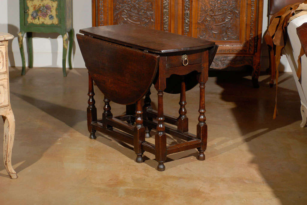 Early 18th Century Georgian Gateleg Table with Frieze Drawer- Circa 1720. This Table is One of a Kind. Please Visit Our Website For Our Complete Inventory jadamsantiques.com
