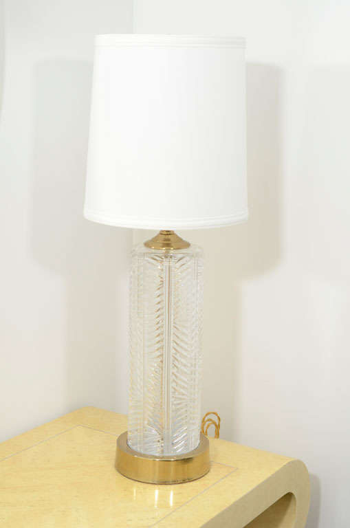 Pair of lead crystal table lamps with a herringbone design and brass hardware made by Cristal d'Albret.  Signed with sticker to base.  France, circa 1950.  

Shades available separately.

Dimensions:
19 inches from socket to base (not including