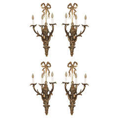 Set of 4 antique French bronze 3-light wall sconces.