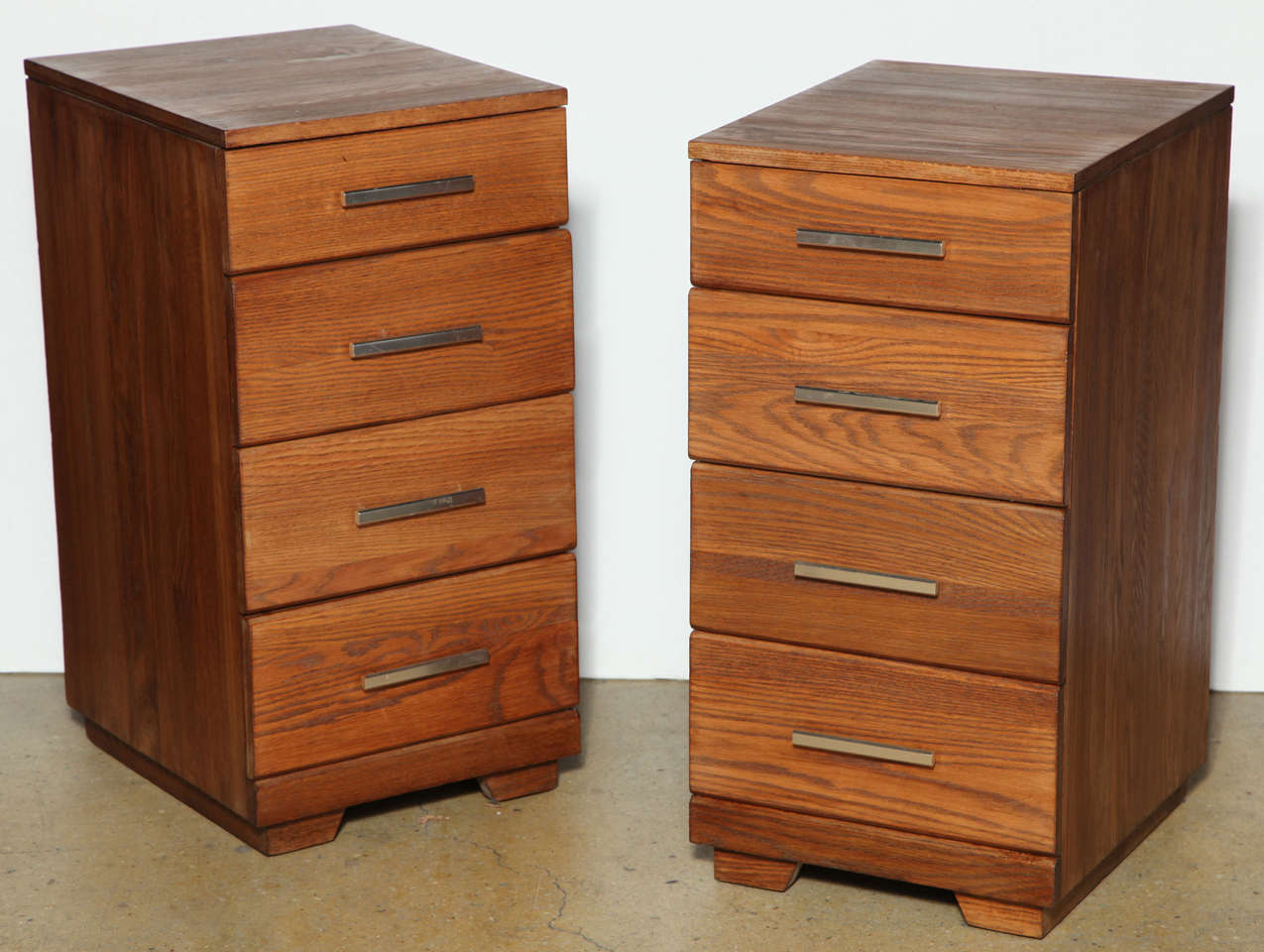 2 Tall Oak Night Stands with 4 drawers and Cast Aluminum pulls.  Top drawer of Side Table complete with 3 sections.  Refinished in Chestnut stain