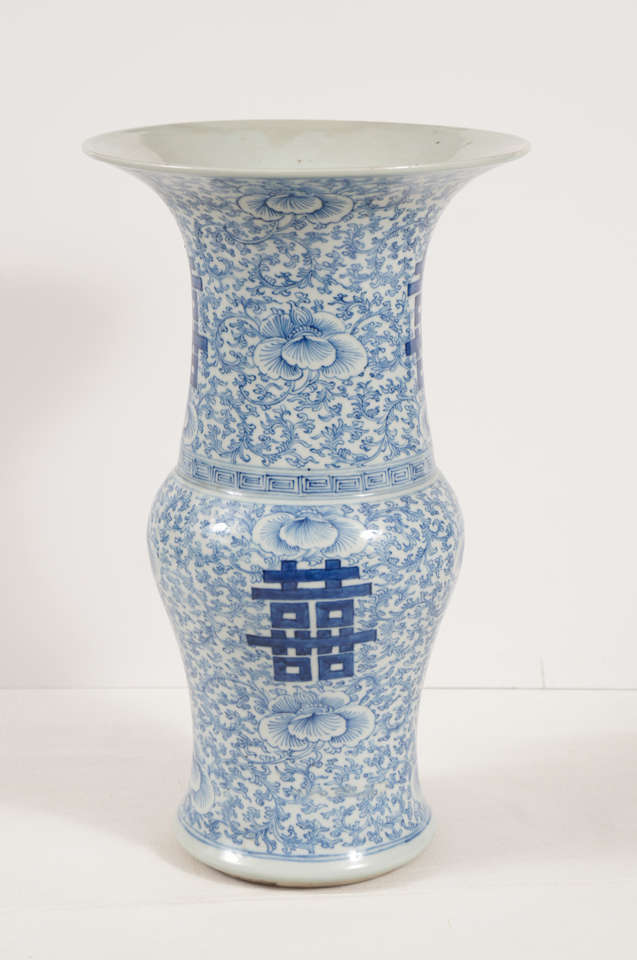 This nice pair of vases in blue and white have been a staple of the western love of Chinese porcelain for over 200 years. Finely painted in a continues vining pattern with peonies and auspicious symbols of happiness. The pair are in good shape well