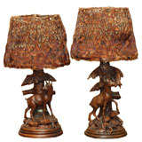 Pair of Black Forest lamps with feather shades.
