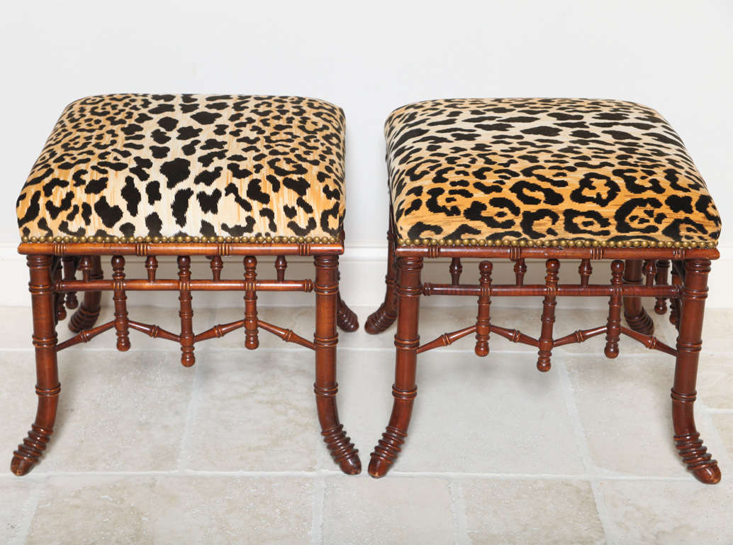 Pair of stools, carved as faux bamboo, each having stuff-over seat upholstered in leopard-print chenille with nailheads.
