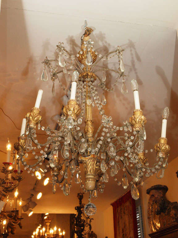 Italian carved Giltwood chandelier with crystal dressing.