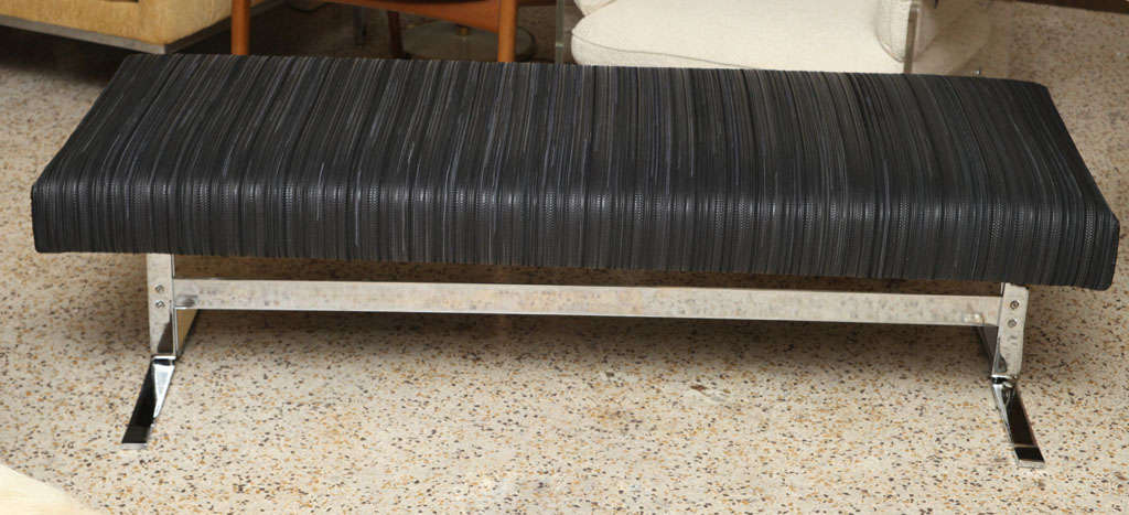 Stunning 60's chromed steel bench after Nicos Zographos has a long and luxe cushion upholstered in black woven leather and suede.