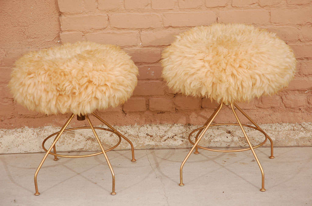 Pair of 1970's  lambs wool poof cushion stools with atomic metal base legs.