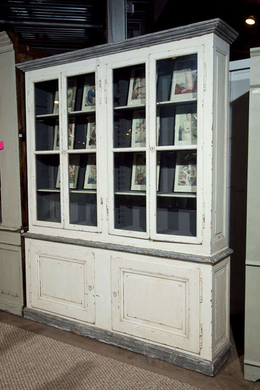 French painted pine bookcase made from painted reclaimed pine, with four glazed top doors over a two door buffet base.