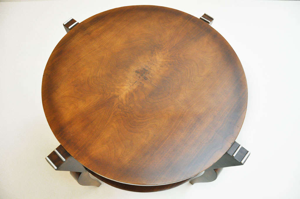 French Art Deco flamed mahogany and nickeled bronze occasional or side table. This exquisite table will be an important addition to your home or office with its geometric form circular top surface featuring a book-matched canvas and a circular lower