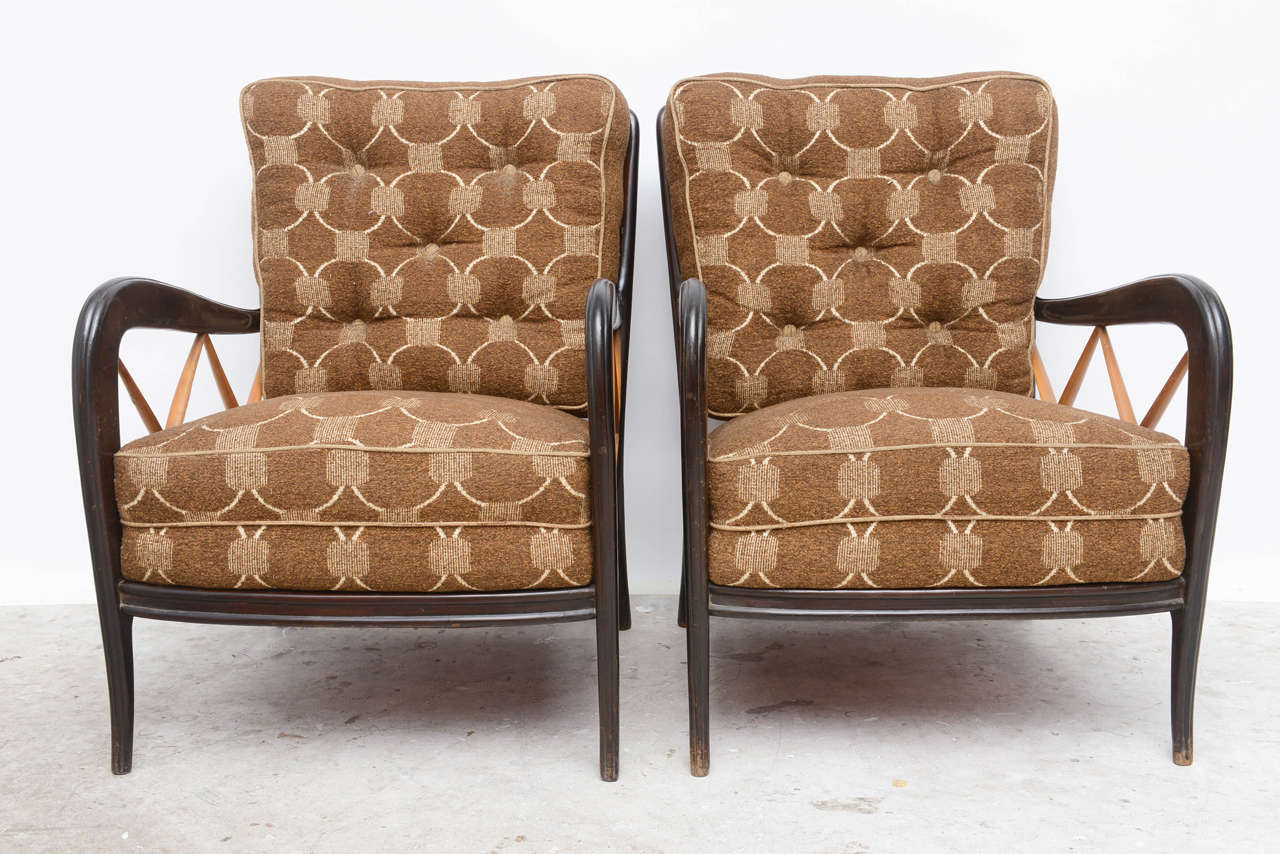 Attributed to Paolo Buffa open-vented lounge chairs with feminine curved frame in an ebonized finish with natural wood embellished crossbar stretcher design or grill motif in a diamond-shaped pattern. Tone on tone plaid tufted seating.