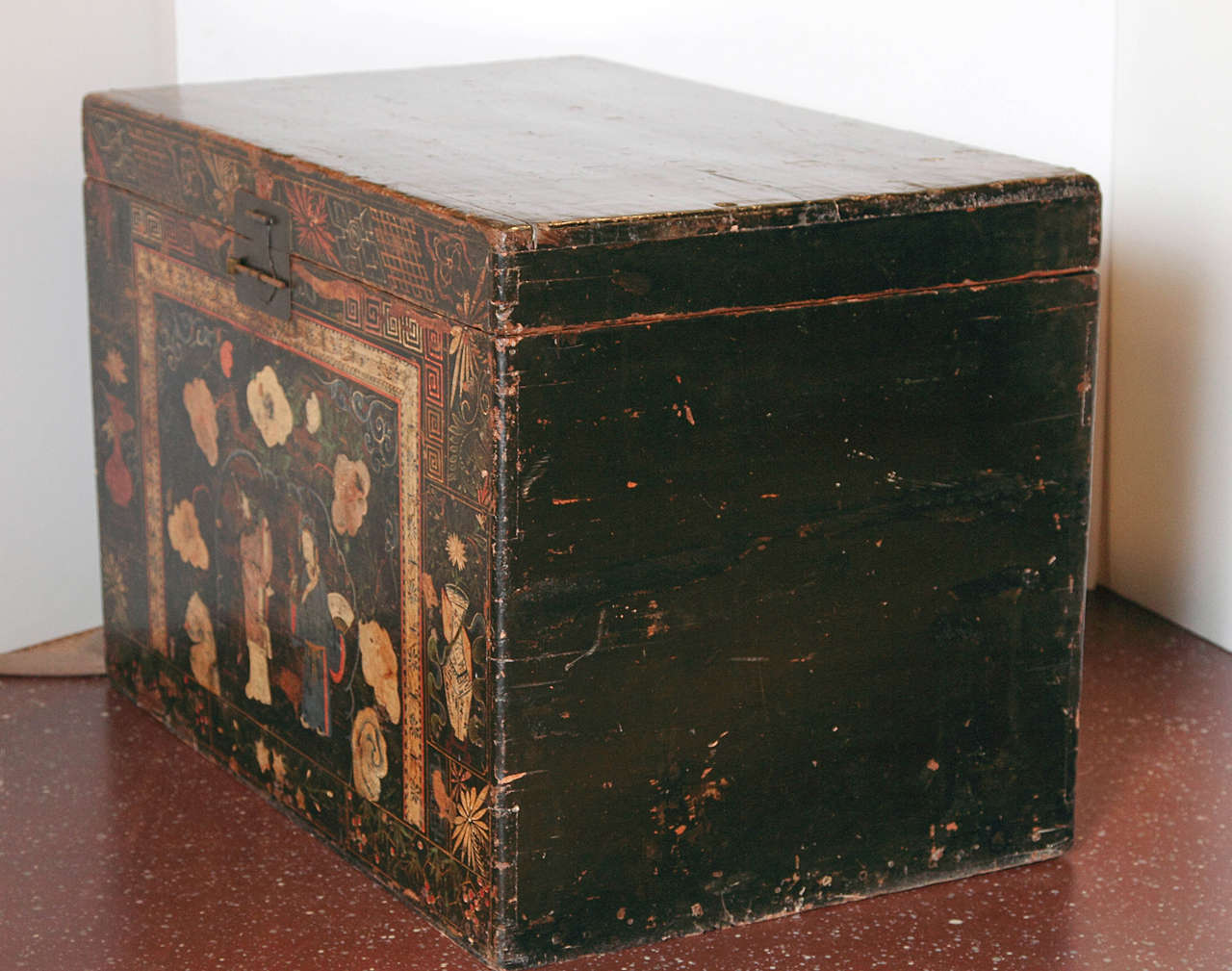 19th century Chinese black painted chest with figural and floral decoration.