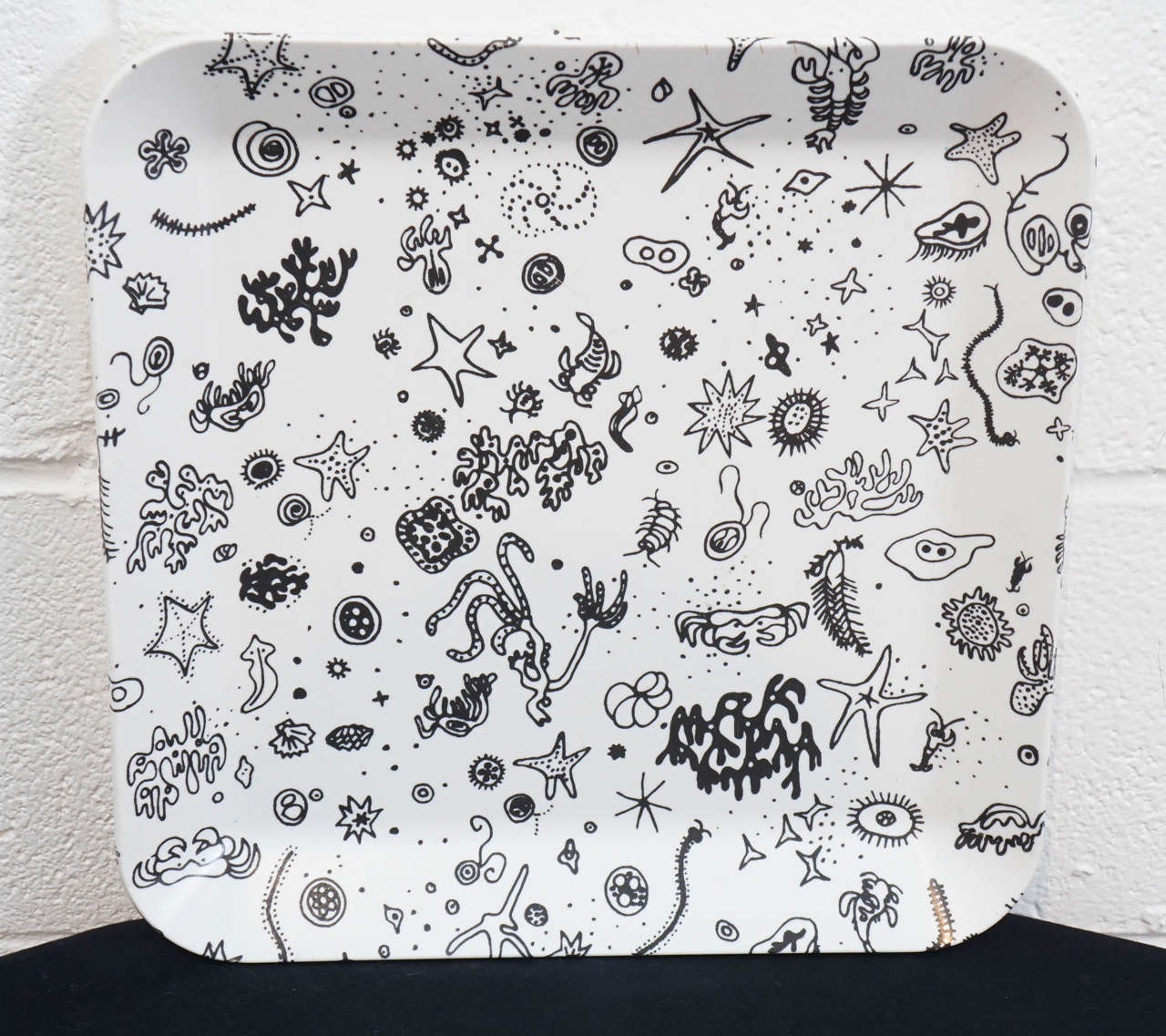 Here is a beautiful tray by Charles and Ray Eames for Waverly Products.
The tray is called Sea Things and features illustrated drawings of sea life.