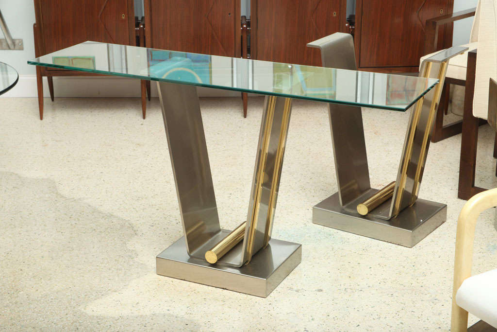 the rectangular glass top above a brushed stainless support with brass accents. Base only dimension 29 3/4x22 1/2x13 1/4
