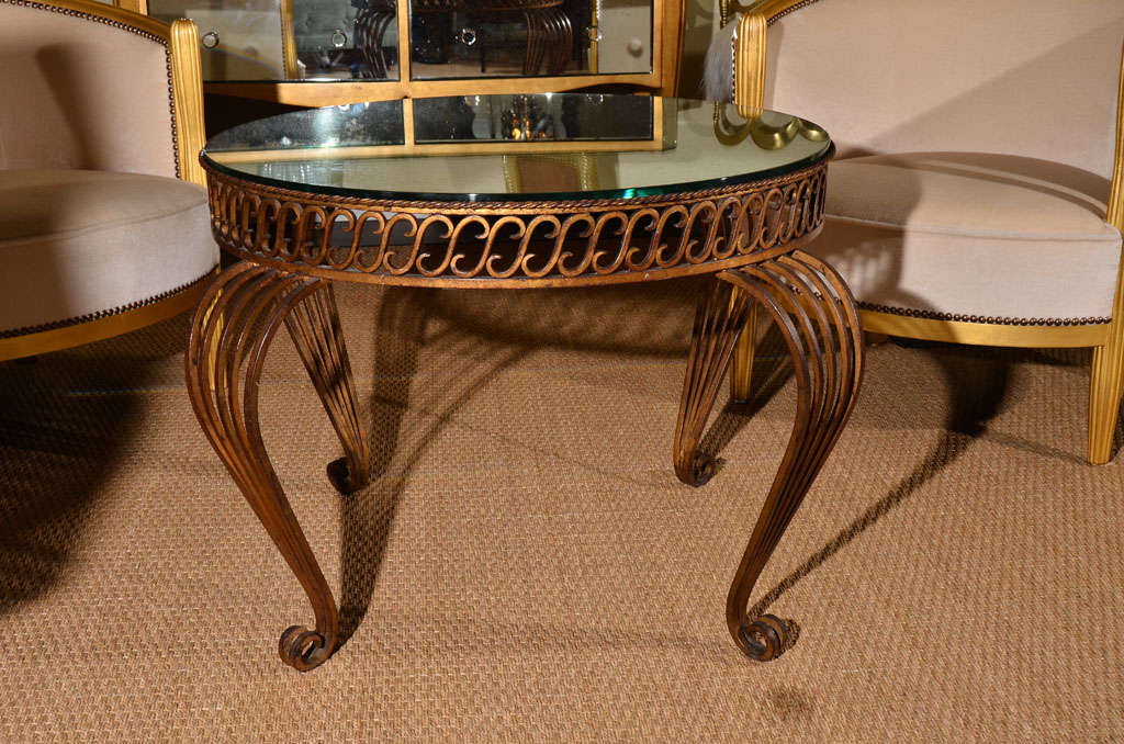 French gilt iron table with antique mirror top In Excellent Condition In Dallas, TX
