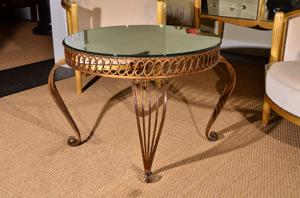 French gilt iron table with antique mirror top, circa 1940's