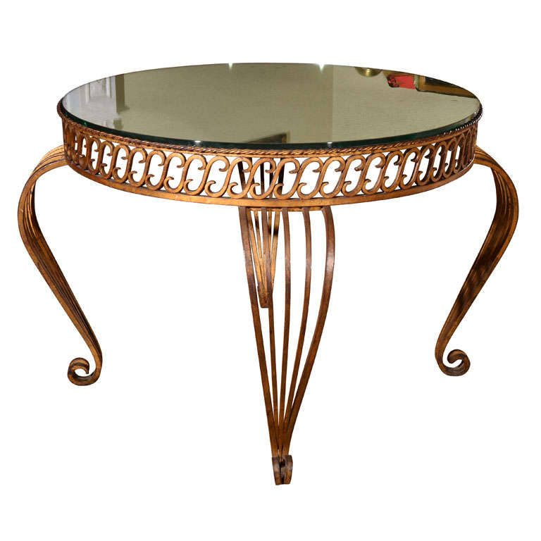 French gilt iron table with antique mirror top