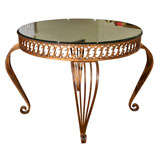 French gilt iron table with antique mirror top