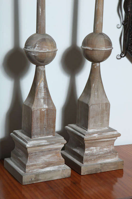 The spear and orb on a plinth base.