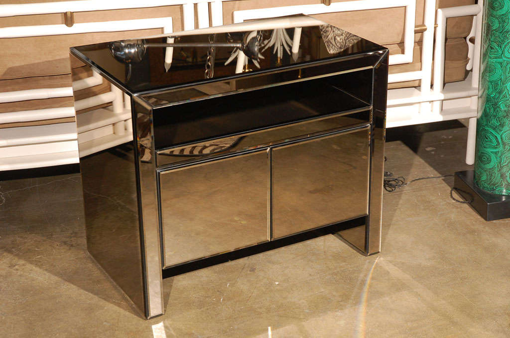 Smoke gray-bronze beveled mirrored cabinet or bedside chest.
Visit the Paul Marra storefront to see more furnishings and lighting including 21st Century.