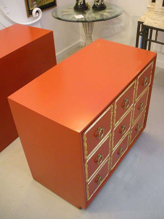 20th Century Pair of orange Dorothy Draper Espana chests of drawers.