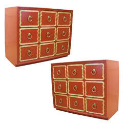 Pair of orange Dorothy Draper Espana chests of drawers.