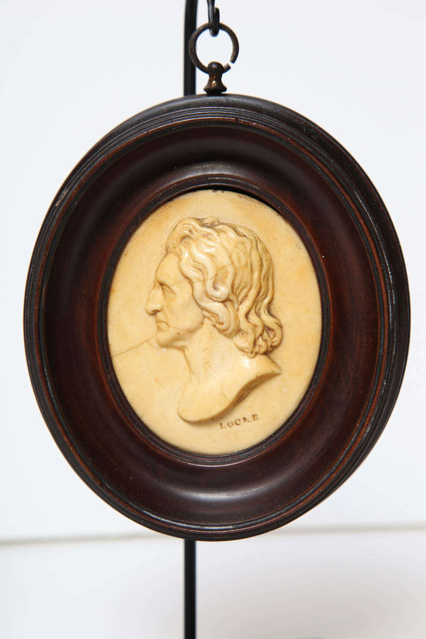 A Pair of 19th Century English Wax Portrait Medallions In Excellent Condition In New York, NY
