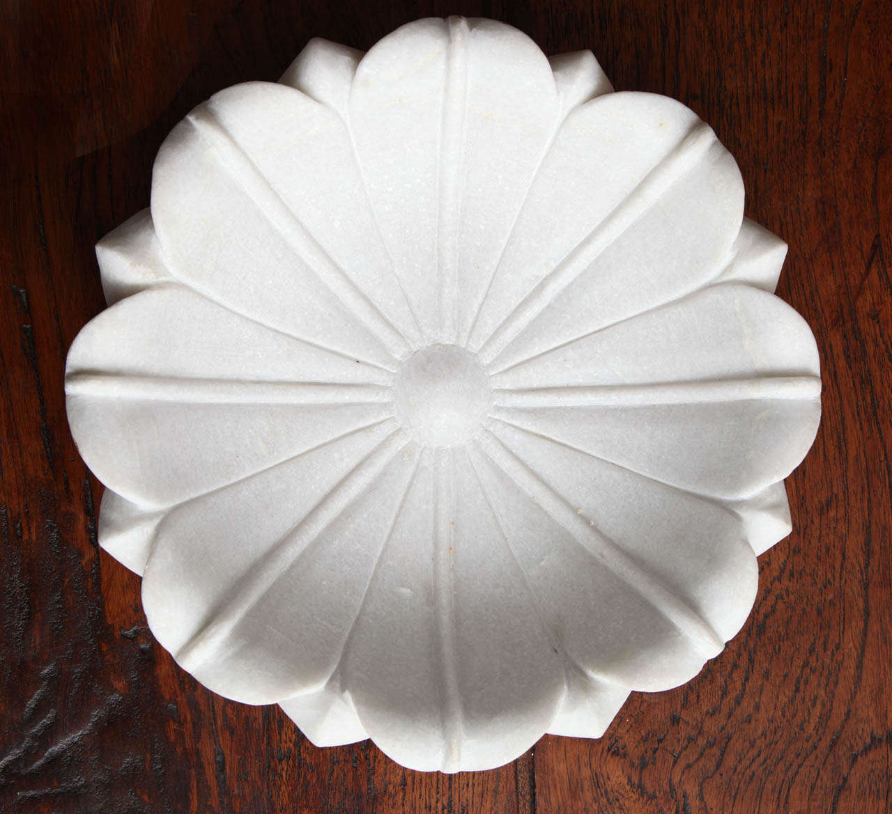 A carved white marble lotus bowl from India.