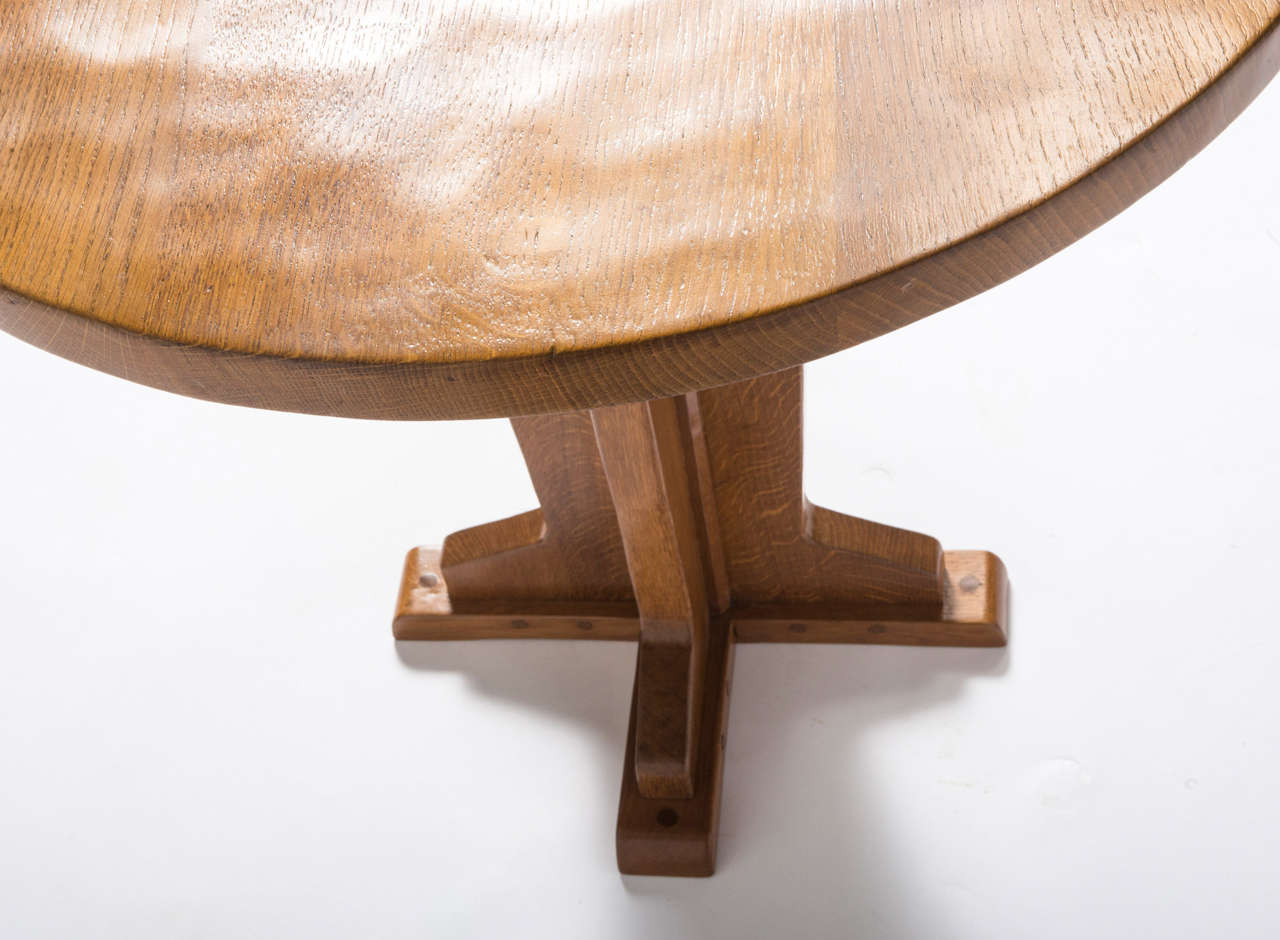 A Robert “Mouseman” Thompson oak side table with circular top on a tapering cruciform base.
Carved mouse.
English,
circa 1960.
Measures: 76cms diameter x 67cms high.